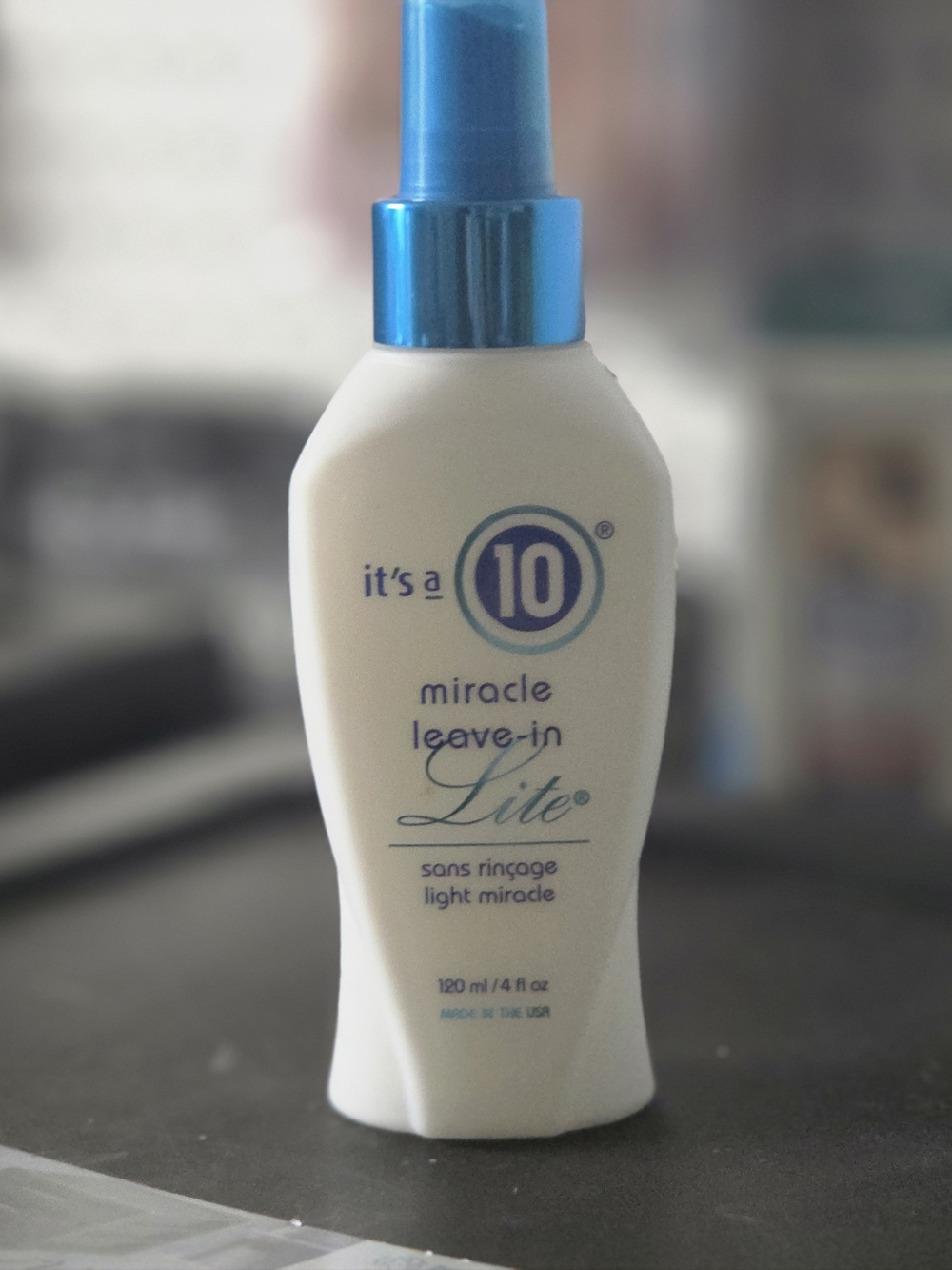 It's a 10 Miracle Leave-In Lite Spray — White & Blue